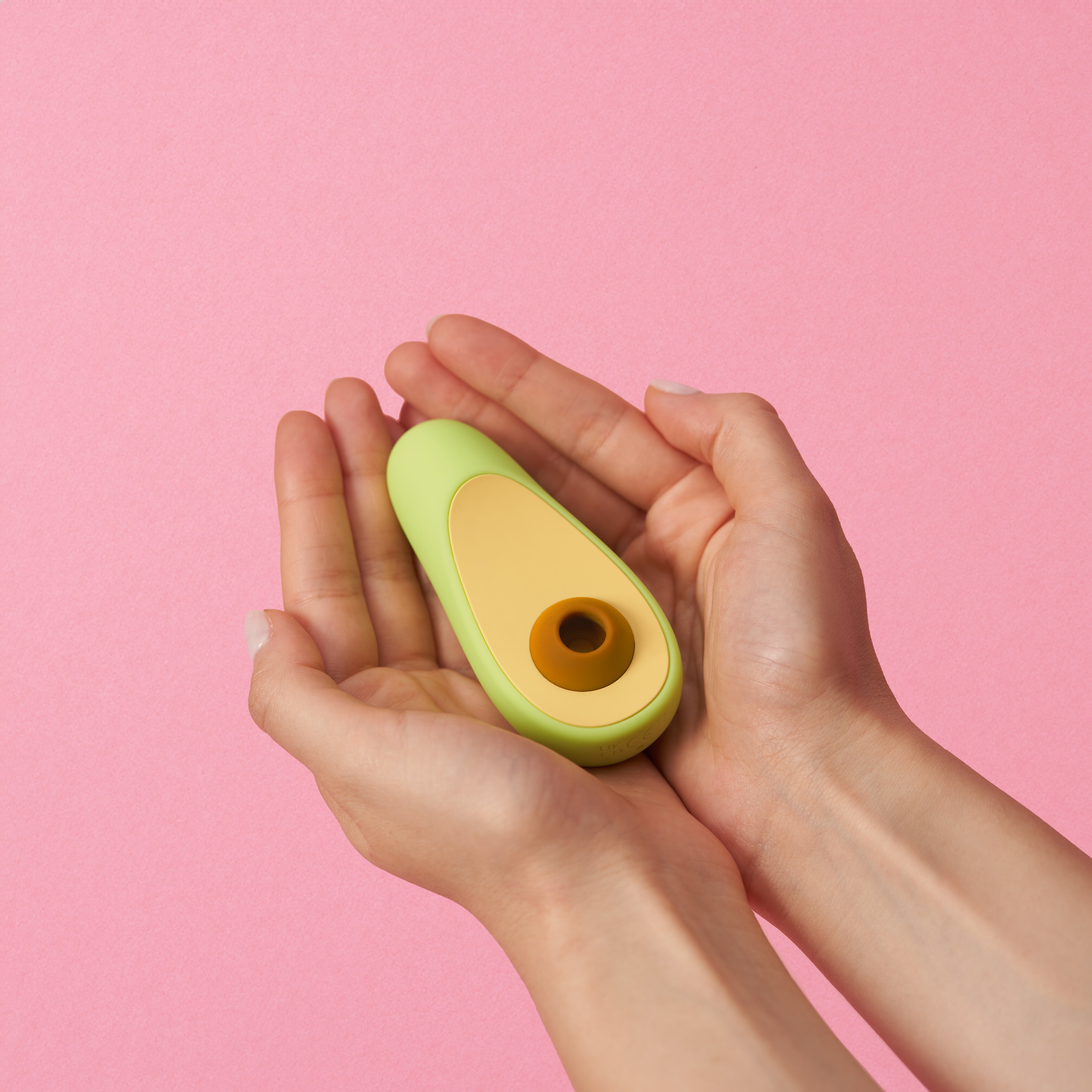 Avocado vibrator in hand