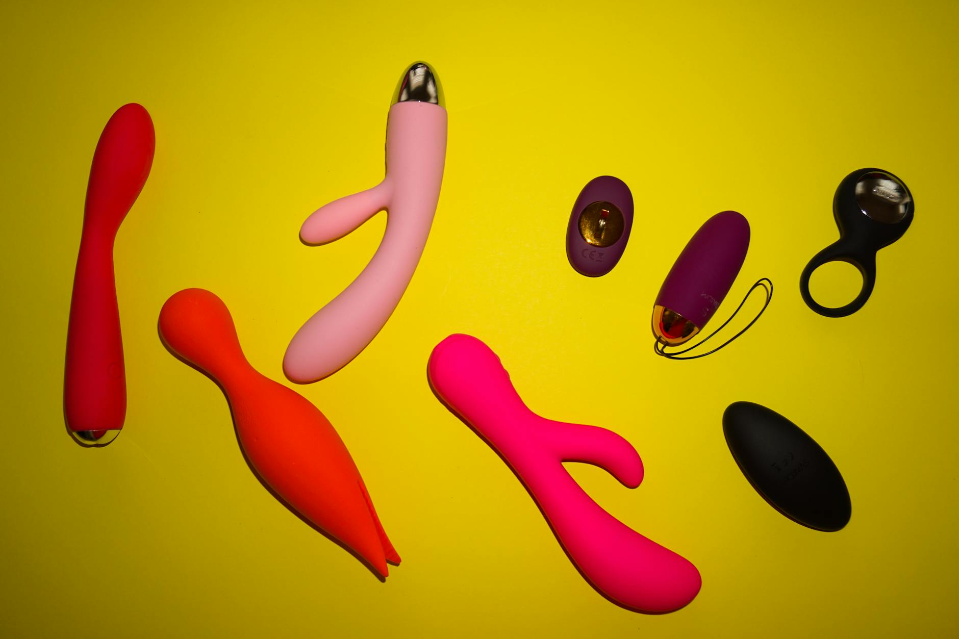 Close-up of colorful vibrators and intimate wellness toys arranged together